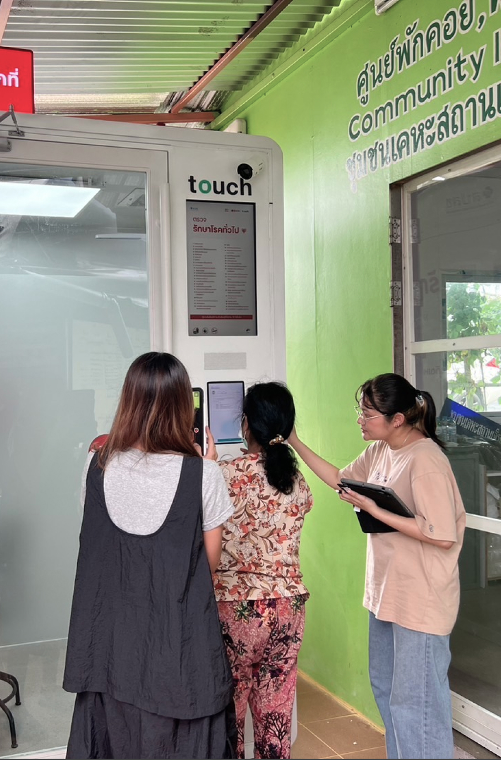 Team testing the Health Cabin check-in screen on site